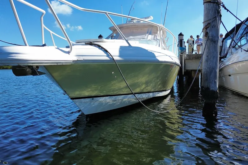  Yacht Photos Pics 2001 Intrepid 377 Walkaround boat docked in sunny marina.