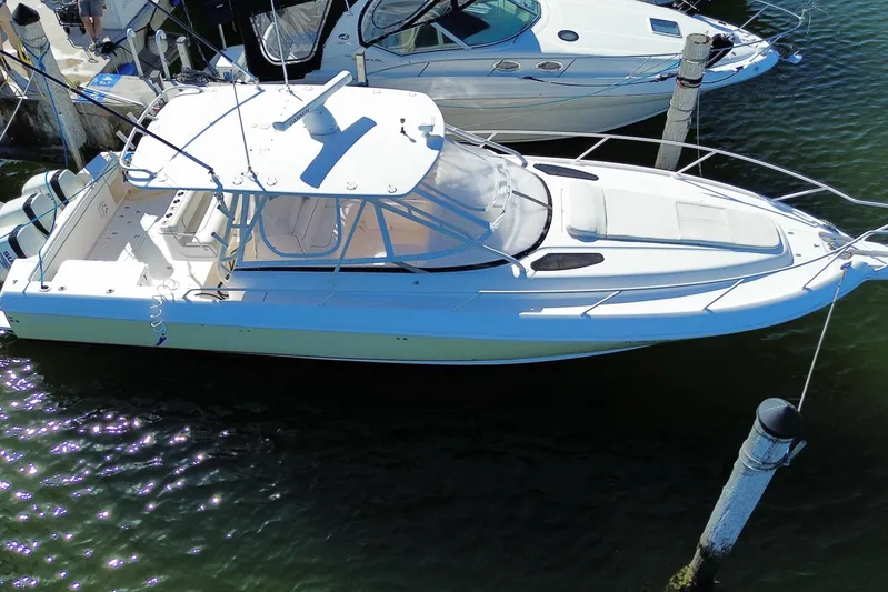  Yacht Photos Pics 2001 Intrepid 377 Walkaround boat docked in marina, aerial view.