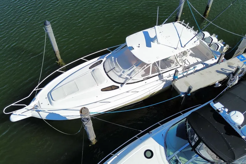  Yacht Photos Pics 2001 Intrepid 377 Walkaround boat docked in marina, aerial view.