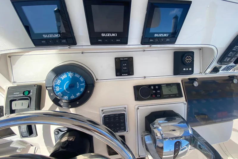  Yacht Photos Pics Control panel of a 2001 Intrepid 377 Walkaround boat with Suzuki displays.