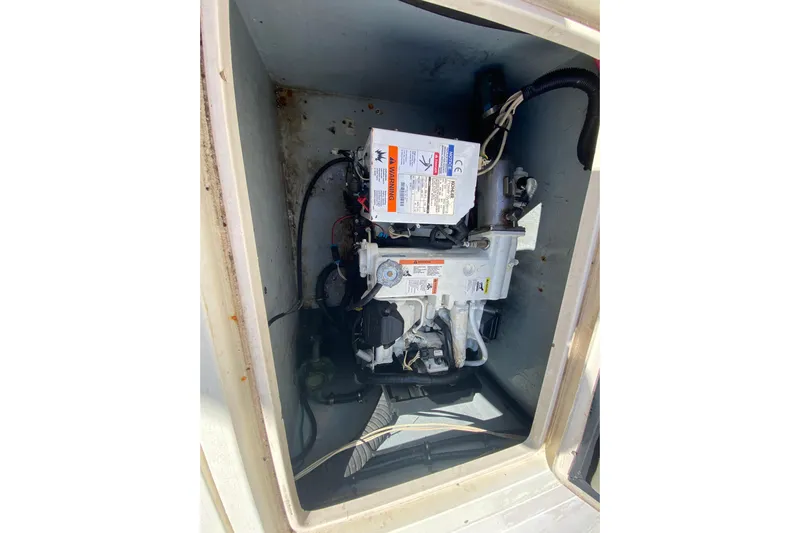  Yacht Photos Pics Engine compartment of a 2001 Intrepid 377 Walkaround boat, showcasing mechanical components.