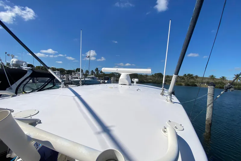  Yacht Photos Pics 2001 Intrepid 377 Walkaround boat docked under clear blue sky.