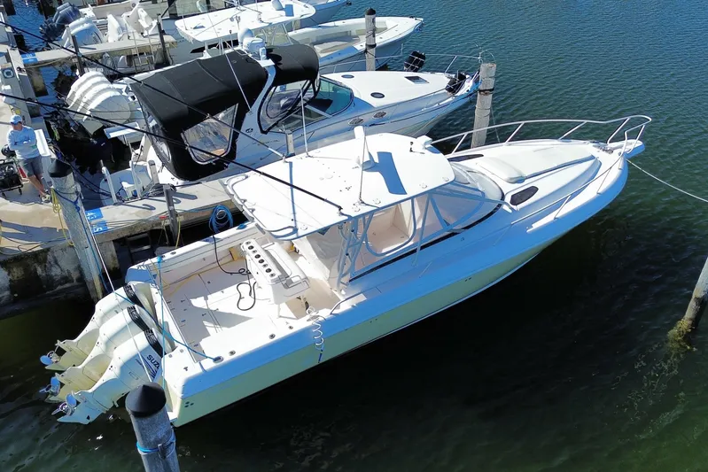  Yacht Photos Pics 2001 Intrepid 377 Walkaround boat docked at marina, aerial view.