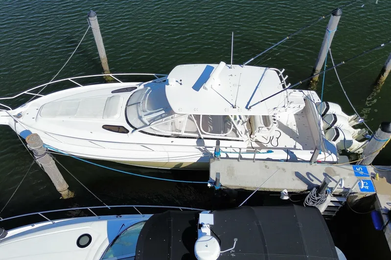  Yacht Photos Pics Aerial view of a 2001 Intrepid 377 Walkaround boat docked at a marina.