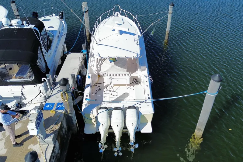  Yacht Photos Pics Aerial view of a 2001 Intrepid 377 Walkaround boat docked at a marina.