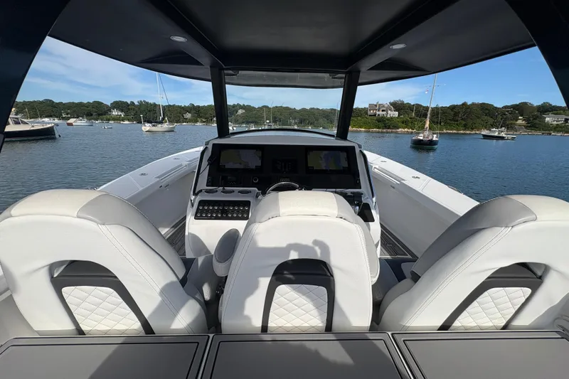 Hammercat 35-115 Yacht Photos Pics Interior view of 2021 Hammer Yachts HammerCat 35, featuring luxurious seating and navigation controls.
