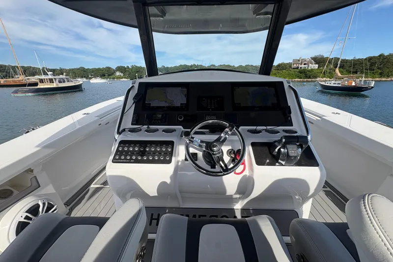 Hammercat 35-115 Yacht Photos Pics Cockpit view of 2021 Hammer Yachts HammerCat 35, featuring modern controls and scenic harbor.