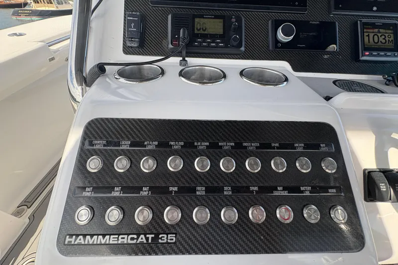 Hammercat 35-115 Yacht Photos Pics Control panel of 2021 Hammer Yachts HammerCat 35 with labeled switches and instruments.
