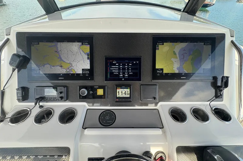 Hammercat 35-115 Yacht Photos Pics 2021 Hammer Yachts HammerCat 35 dashboard with navigation screens and controls.