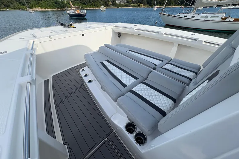 Hammercat 35-115 Yacht Photos Pics Luxurious seating on 2021 Hammer Yachts HammerCat 35, docked with scenic water view.