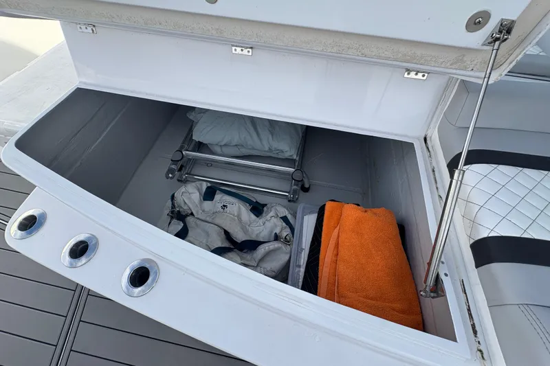 Hammercat 35-115 Yacht Photos Pics Storage compartment on 2021 Hammer Yachts HammerCat 35, featuring towels and equipment.