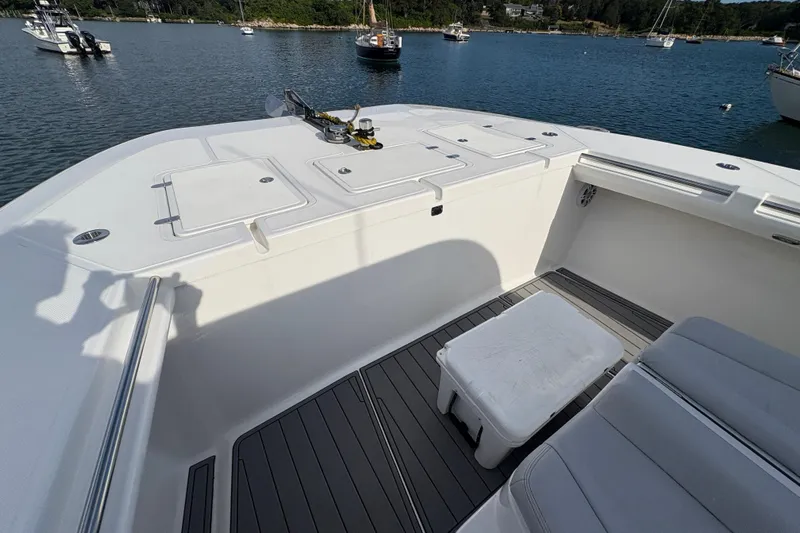 Hammercat 35-115 Yacht Photos Pics 2021 Hammer Yachts HammerCat 35 deck with seating, storage, and scenic harbor view.