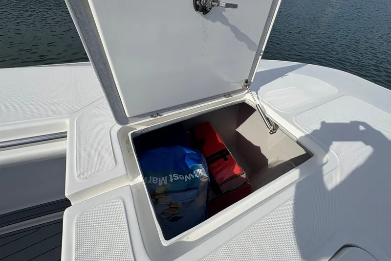 Hammercat 35-115 Yacht Photos Pics Open storage compartment on 2021 Hammer Yachts HammerCat 35, showing interior contents.