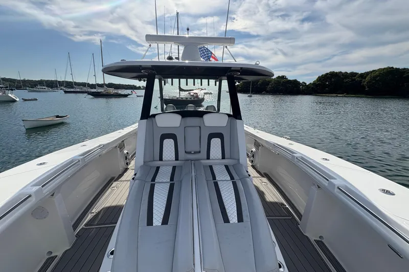 Hammercat 35-115 Yacht Photos Pics 2021 Hammer Yachts HammerCat 35 on serene water, showcasing sleek design and spacious deck.