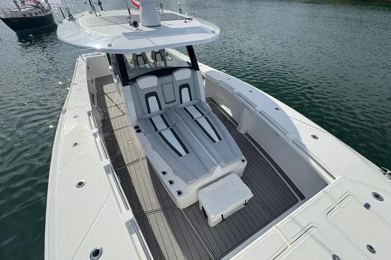 Hammercat 35-115 Yacht Photos Pics 2021 Hammer Yachts HammerCat 35 on water, showcasing sleek deck design and seating.