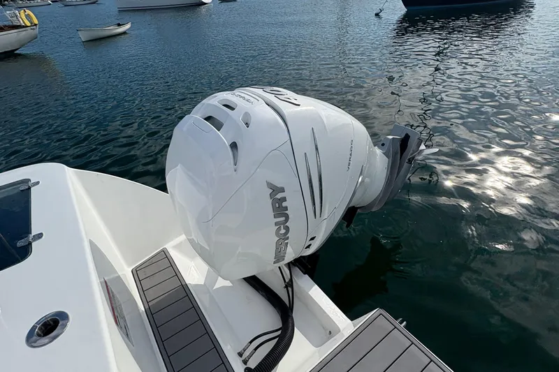 Hammercat 35-115 Yacht Photos Pics Outboard motor on 2021 Hammer Yachts HammerCat 35, docked on calm water.