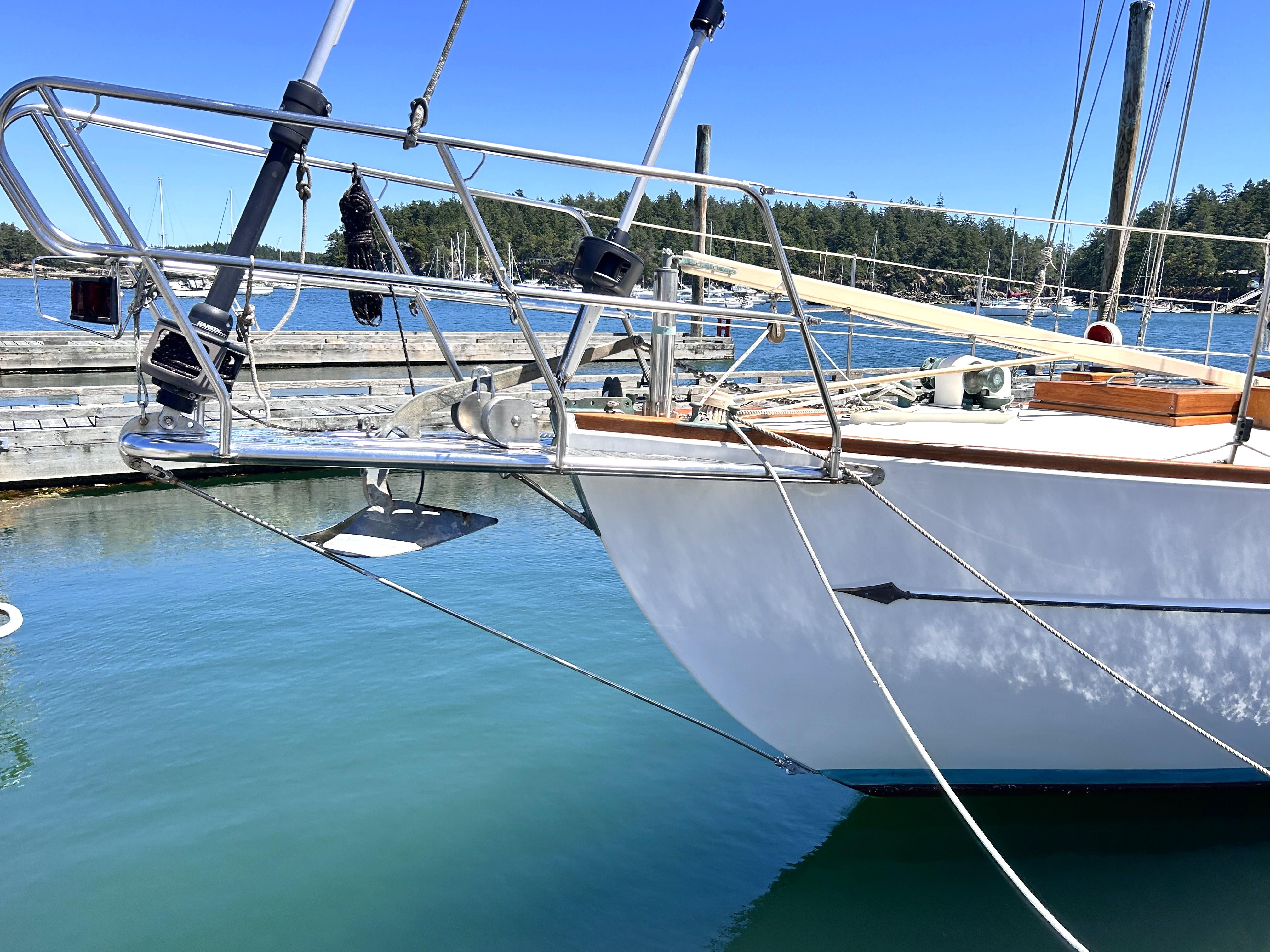 Bow of a 1927 Custom George Wayland 40 sailboat in harbor.
