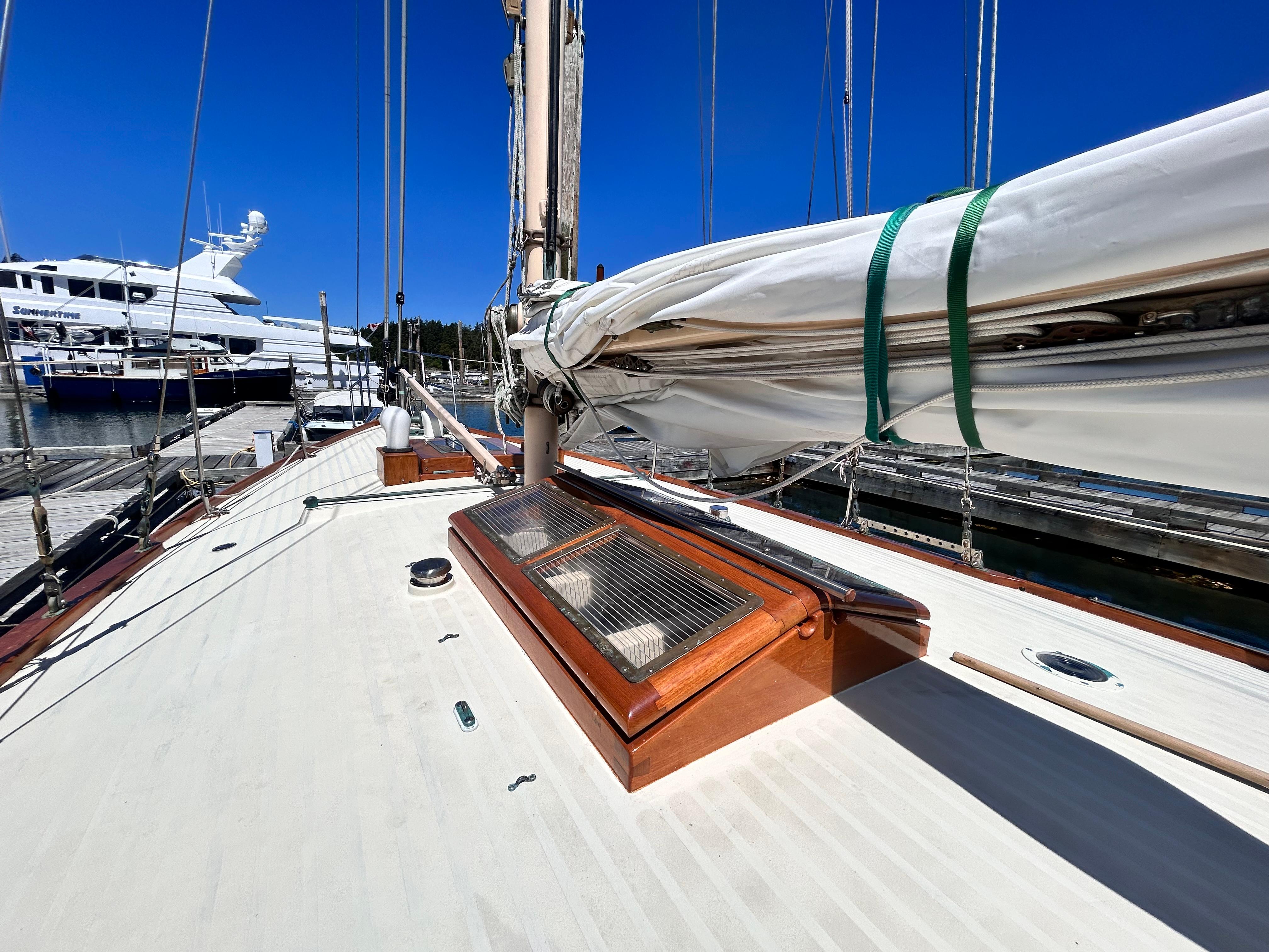 Deck of a 1927 Custom George Wayland 40 sailboat in harbor.