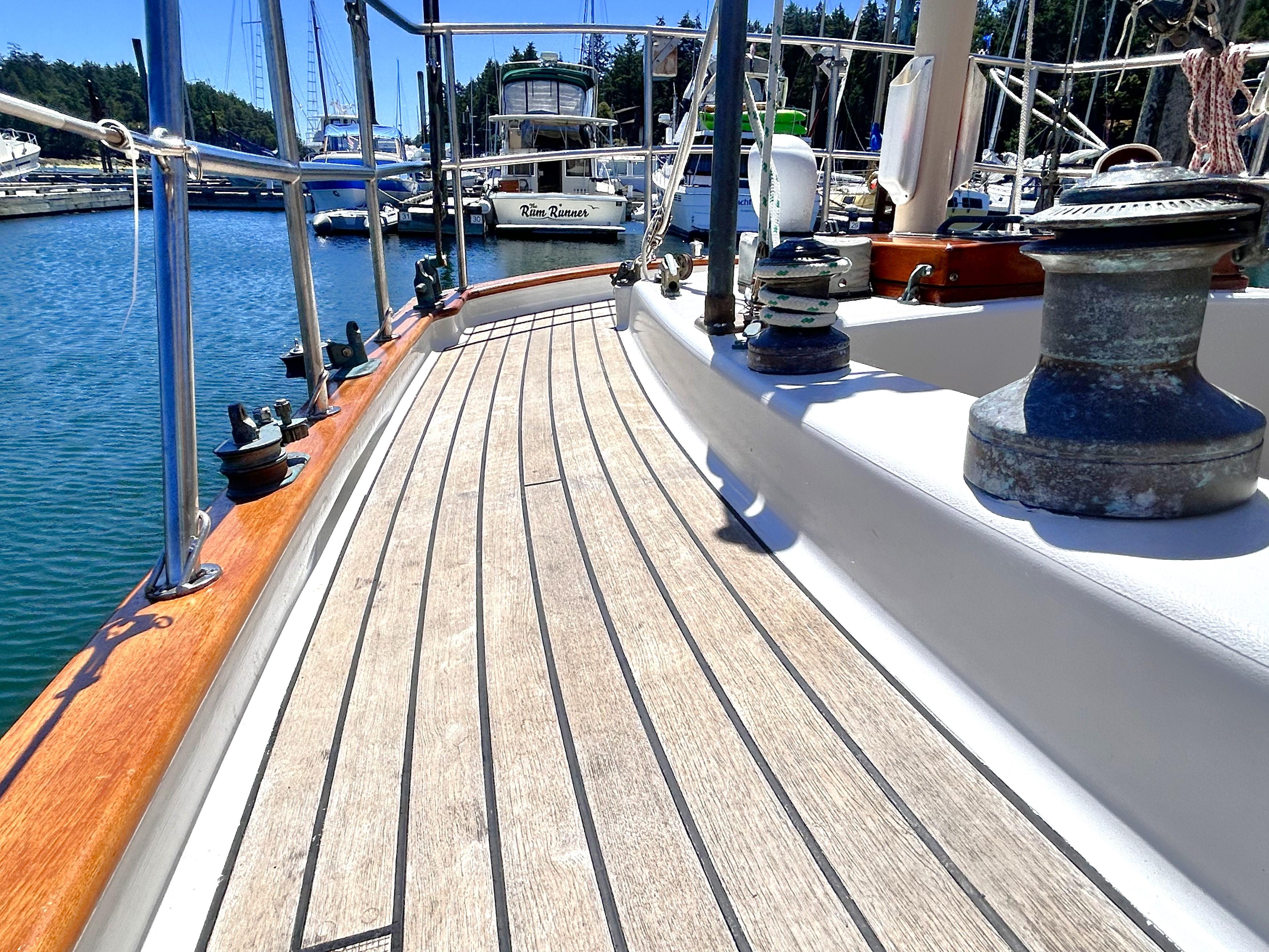Deck of a 1927 George Wayland 40 sailboat in harbor.