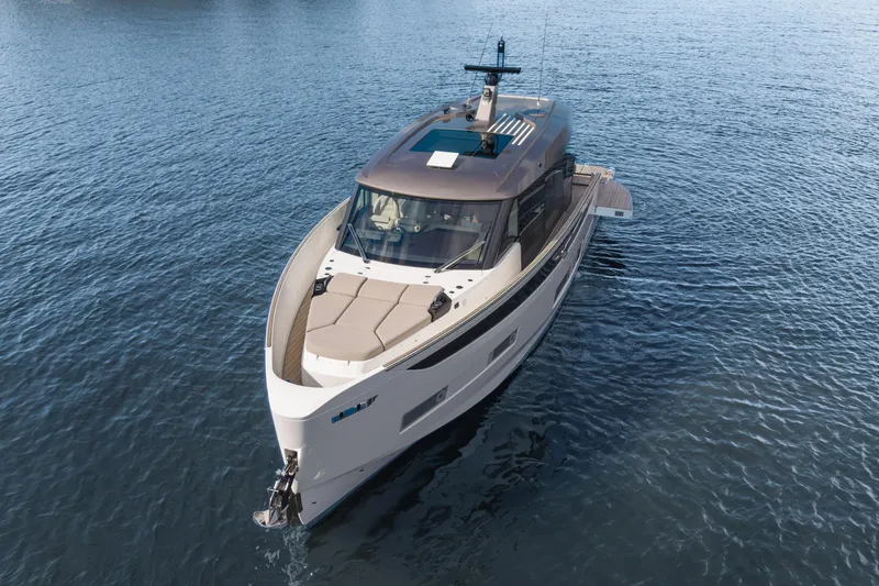  Yacht Photos Pics 2025 Azimut Seadeck 6 yacht on calm blue water, aerial view.