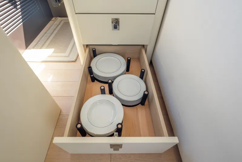  Yacht Photos Pics Drawer with neatly stacked plates on Azimut Seadeck 6 yacht, 2025 model.
