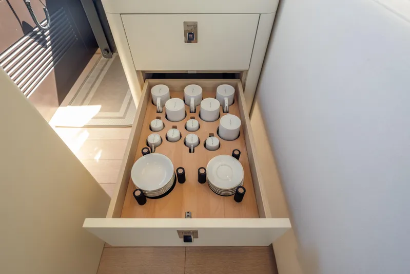  Yacht Photos Pics Drawer with neatly organized cups and plates on the 2025 Azimut Seadeck 6 yacht.