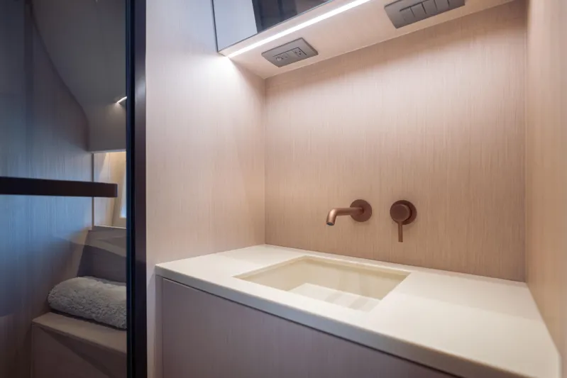  Yacht Photos Pics Luxurious bathroom interior of 2025 Azimut Seadeck 6 yacht with modern fixtures.