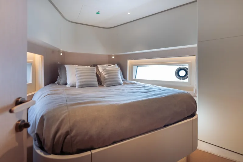  Yacht Photos Pics Luxurious bedroom interior of 2025 Azimut Seadeck 6 yacht with modern design.