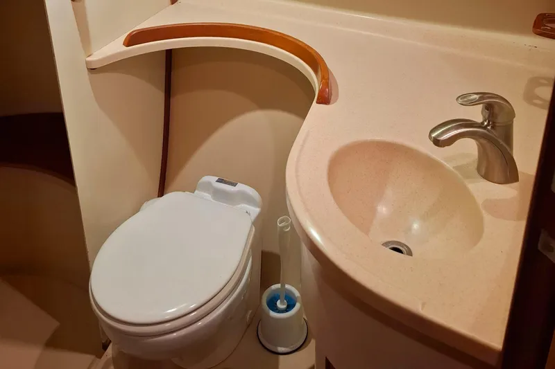 Priva Sea Yacht Photos Pics Bathroom interior of 2003 Island Packet 485 yacht, featuring toilet and sink.