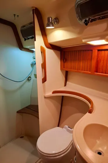 Priva Sea Yacht Photos Pics Luxurious bathroom in 2003 Island Packet 485 yacht with wooden accents and modern fixtures.