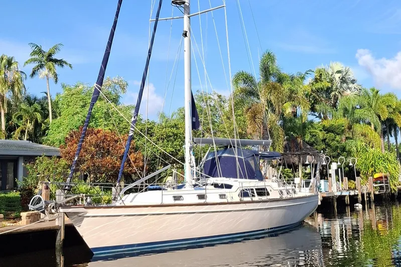 Priva Sea Yacht Photos Pics Island Packet 485 sailboat docked near tropical foliage, 2003 model.