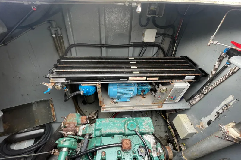 Futuna Yacht Photos Pics Engine room of a 2004 Lagoon 570 yacht, featuring mechanical components and wiring.