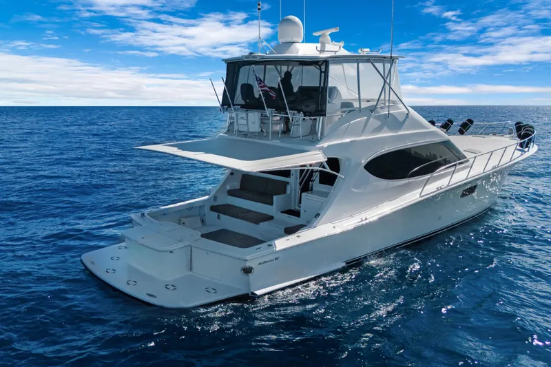  Yacht Photos Pics 2016 Hatteras 63GT yacht cruising on open blue ocean under clear sky.