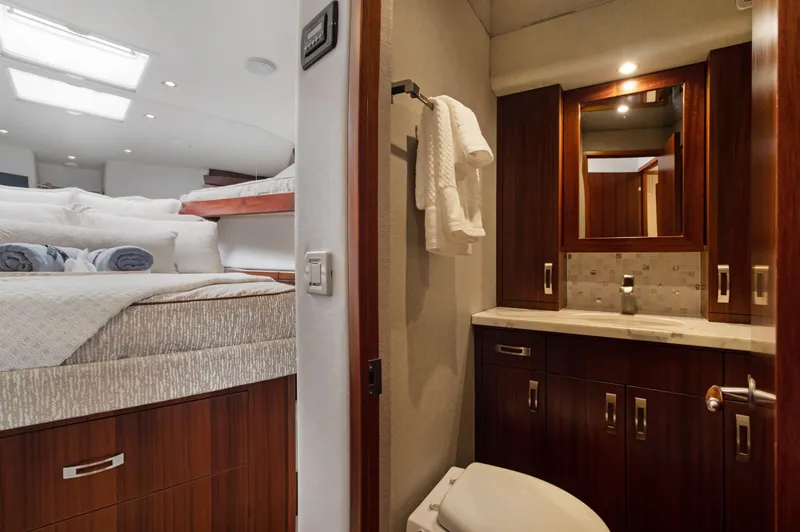  Yacht Photos Pics Luxurious 2016 Hatteras 63GT yacht interior with cozy bedroom and elegant bathroom.