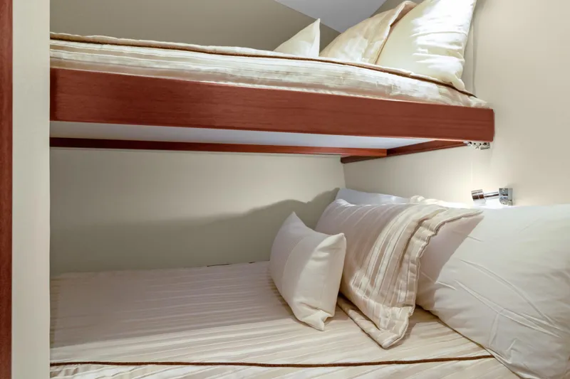  Yacht Photos Pics Bunk beds in 2016 Hatteras 63GT yacht cabin with cozy bedding.