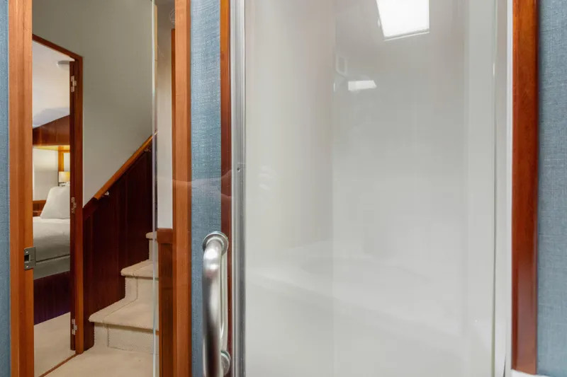  Yacht Photos Pics Interior of 2016 Hatteras 63GT yacht, featuring stairs and a modern door design.