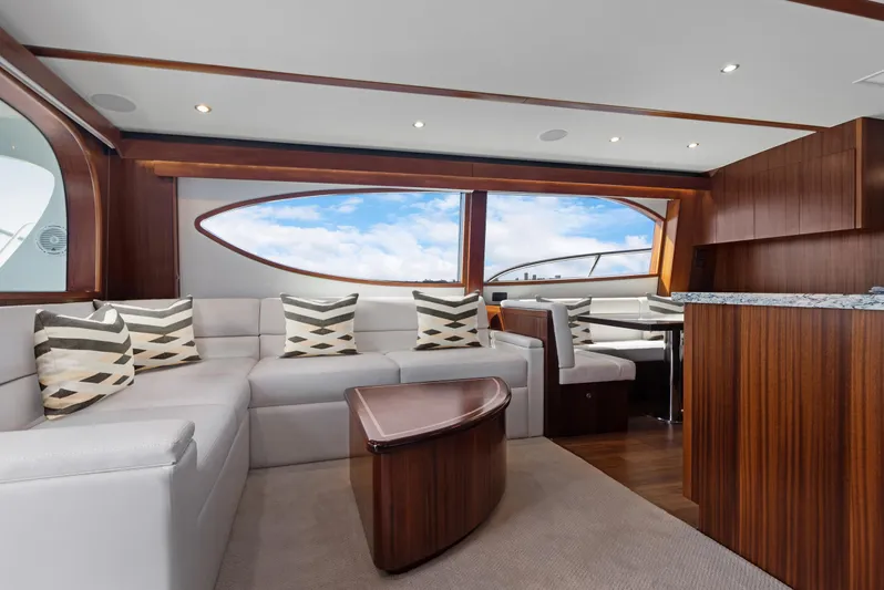  Yacht Photos Pics Luxurious interior of 2016 Hatteras 63GT yacht with modern seating and large windows.