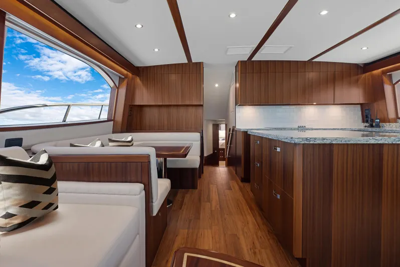  Yacht Photos Pics Luxurious interior of 2016 Hatteras 63GT yacht with wood finishes and modern design.