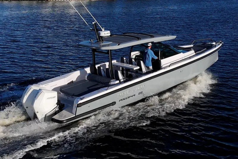 Chye-lukh Yacht Photos Pics 2021 Axopar 37 boat cruising on water with dual Mercury engines.