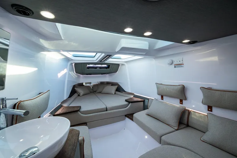 Chye-lukh Yacht Photos Pics Luxurious interior of 2021 Axopar 37 boat with modern seating and skylights.