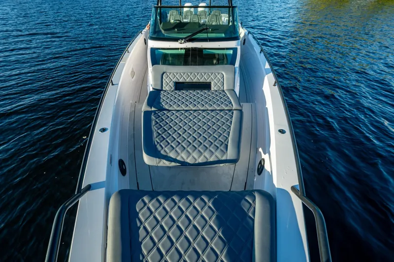 Chye-lukh Yacht Photos Pics 2021 Axopar 37 boat with luxurious seating on calm water.