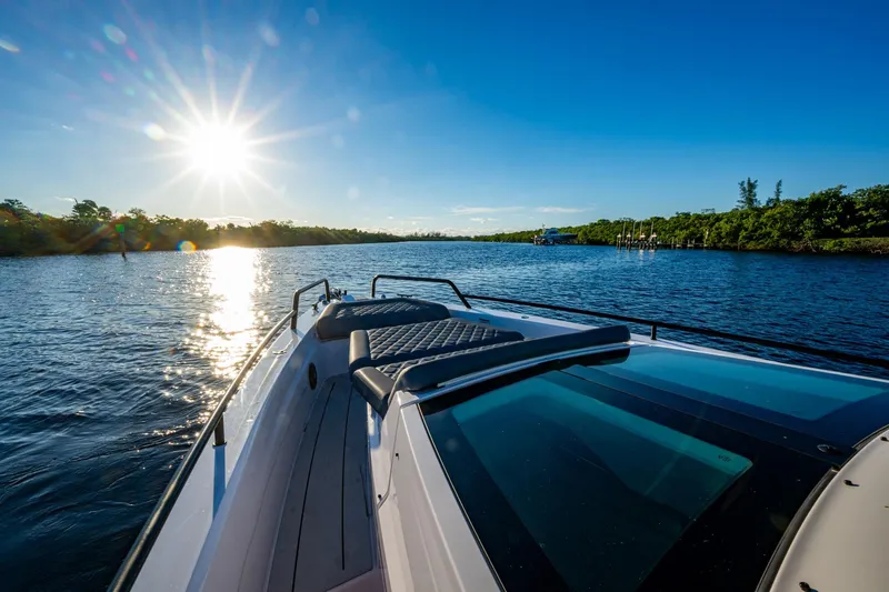 Chye-lukh Yacht Photos Pics 2021 Axopar 37 boat cruising on a sunny day, scenic waterway view.