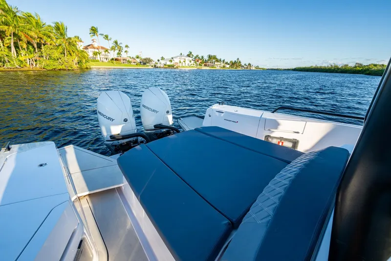 Chye-lukh Yacht Photos Pics 2021 Axopar 37 boat with twin Mercury engines on a scenic waterway.