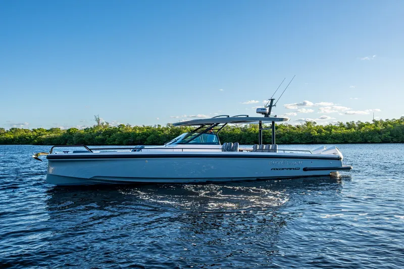 Chye-lukh Yacht Photos Pics 2021 Axopar 37 boat on calm water with clear blue sky background.