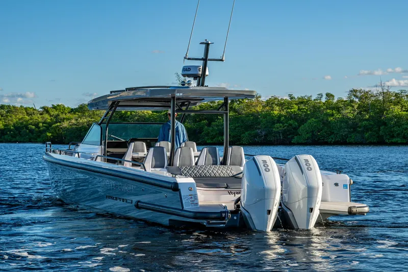 Chye-lukh Yacht Photos Pics 2021 Axopar 37 boat with dual engines on a serene waterway.
