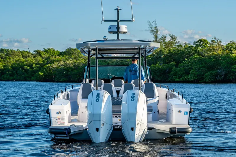 Chye-lukh Yacht Photos Pics 2021 Axopar 37 boat with dual engines cruising on a scenic waterway.