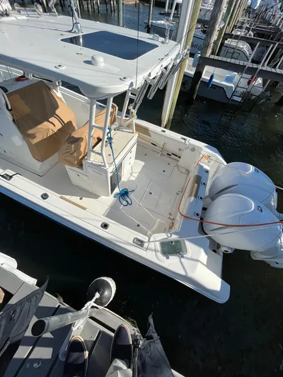  Yacht Photos Pics 2022 Edgewater 285CC boat docked with twin engines, viewed from above.