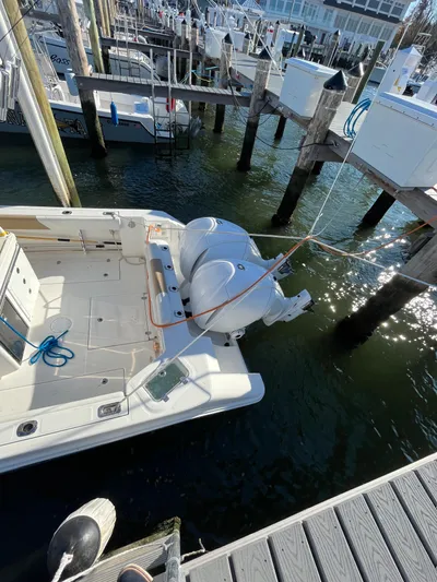  Yacht Photos Pics 2022 Edgewater 285CC boat docked at marina with twin engines.