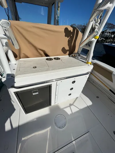  Yacht Photos Pics 2022 Edgewater 285CC boat interior with storage and seating area.