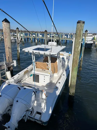  Yacht Photos Pics 2022 Edgewater 285CC boat docked at marina with twin engines.